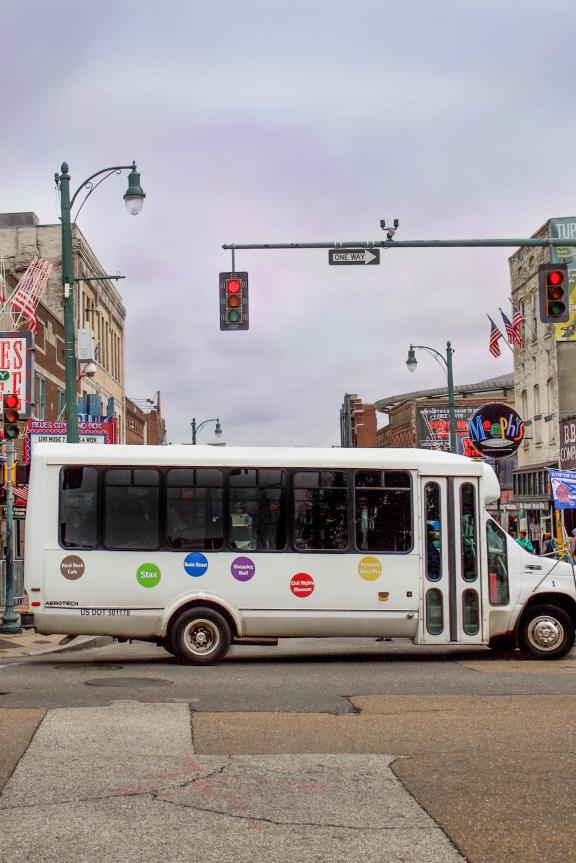Blues City Tours bus drives by Beale Street