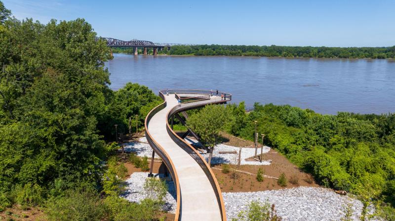 a 220-foot elevated walkway stretches over wetland and tree canopies looking out to the Mississippi River