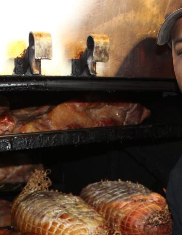 Pitmaster in front of the pit at Marlowe's Ribs & Restaurant. 