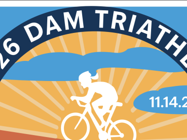 white sihloutte of a woman riding a bike against a yellow and blue background, 2026 DAM TRIATHLON