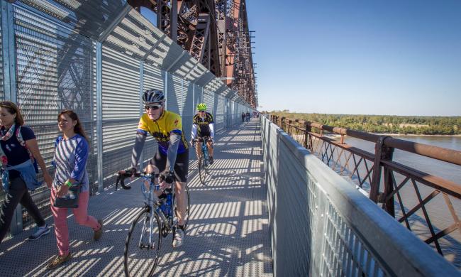 Bikers going across Big River Crossing