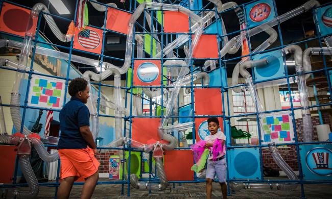 Children playing at an exhibit inside the Children's Museum of Memphis.