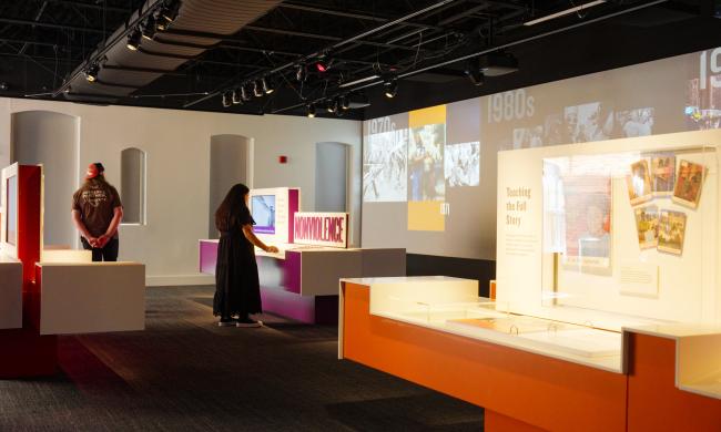 woman looks at nonviolence prison charges exhibit at National Civil Rights Museum Legacy Experience