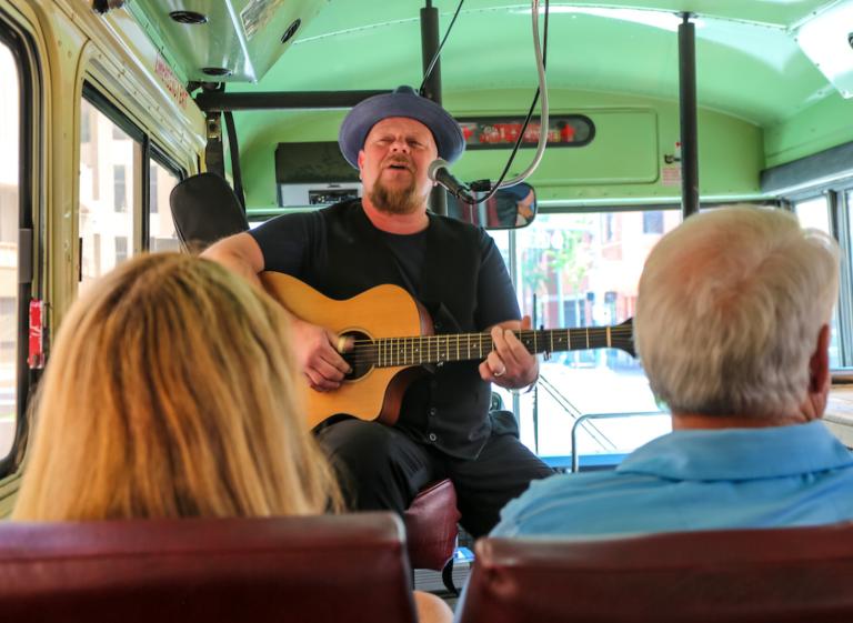 Backbeat Tour Guide playing guitar Photo 5