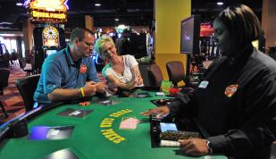 Two people playing table games at Southland Park Gaming | Andrea Zucker
