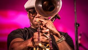 man plays trumpet