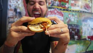 man eating BBQ Sandwich